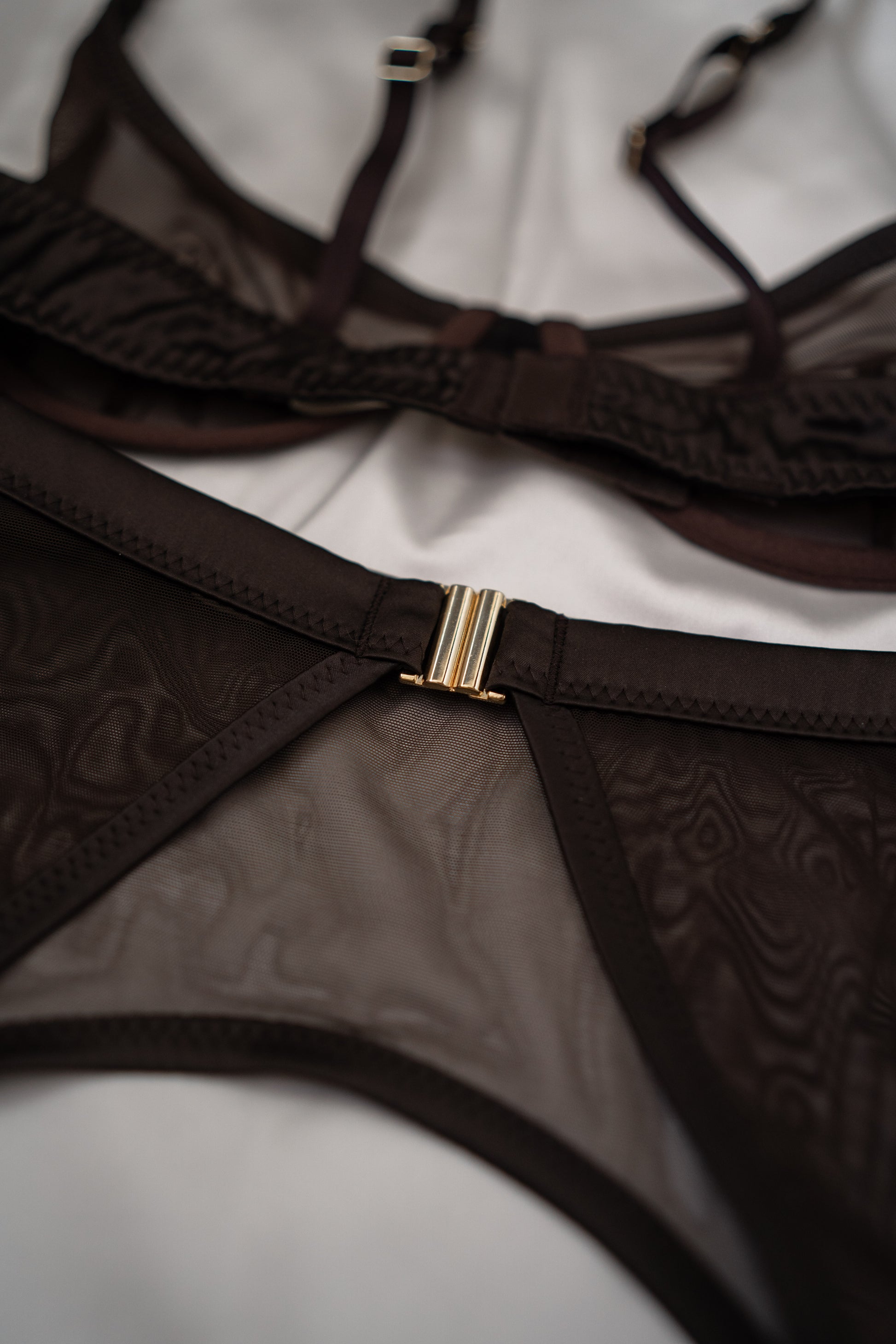 Close-up of brown mesh fabric and fine strap details Tate set