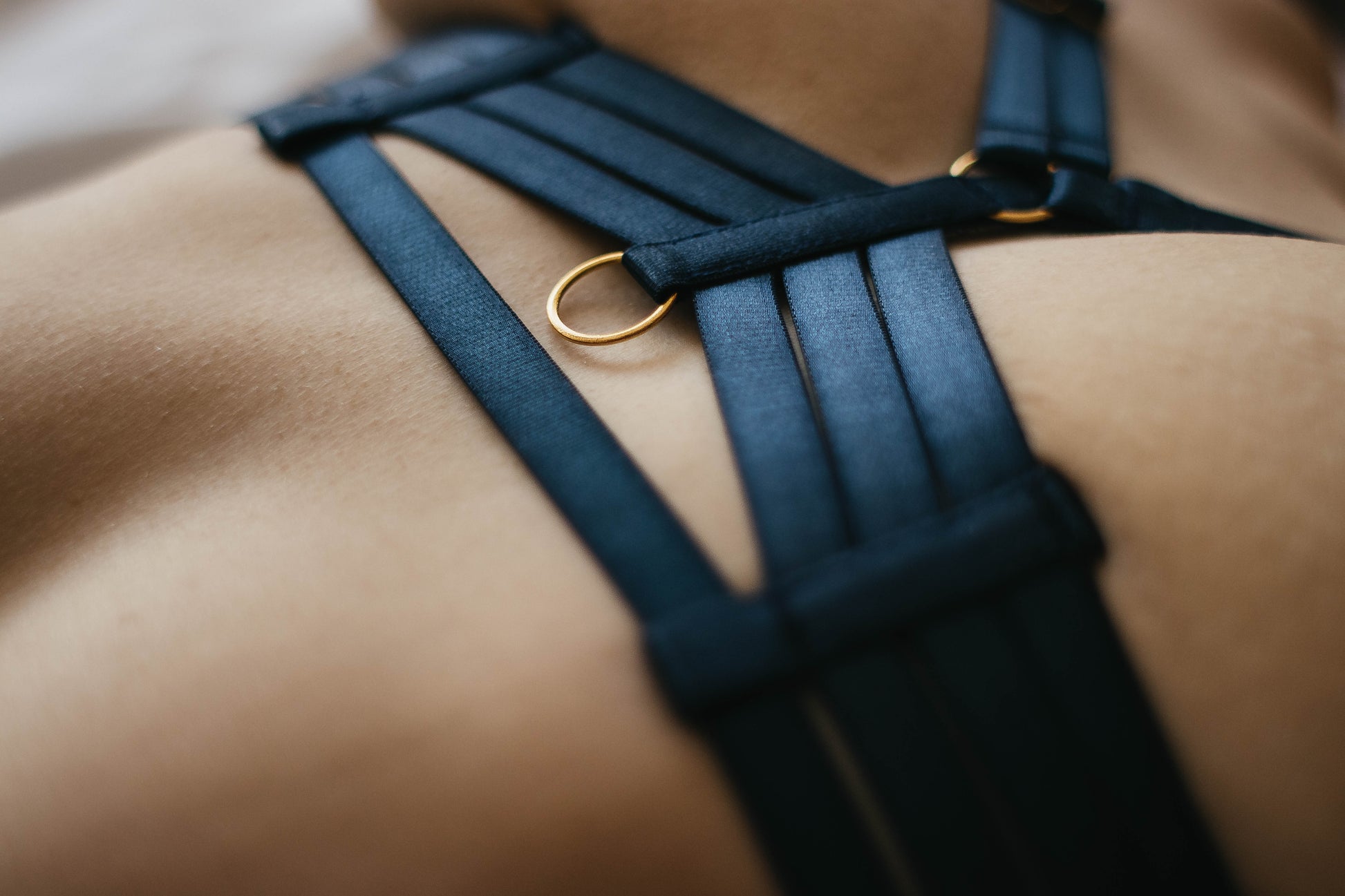 Close-up elastic strap and ring details of Ivana harness lingerie